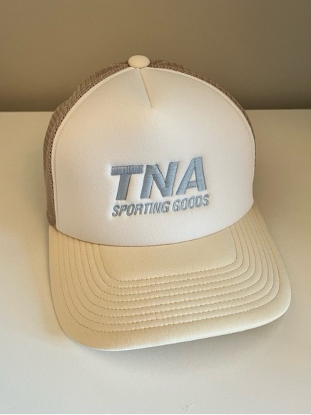 TNA White Front Beige Mesh Trucker Hat with Light Blue Logo